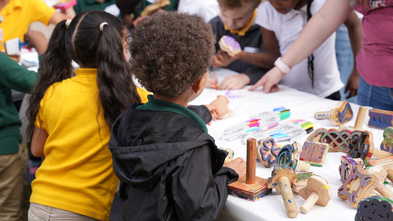 A group of students work on a craft.