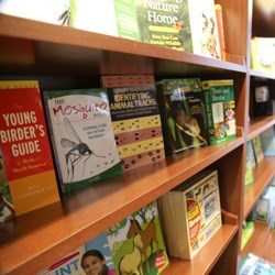 Books on a shelf in the Nature Center bookstore.