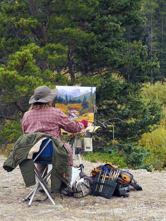 Artist painting a picture in RMNP