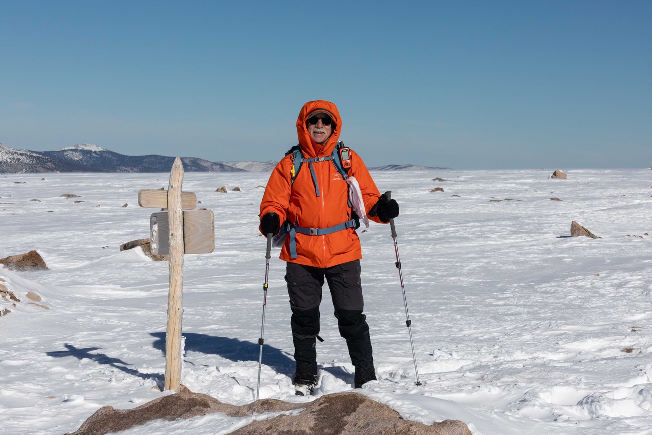 Hiker at the Summit of Flattop Mountain in Winter