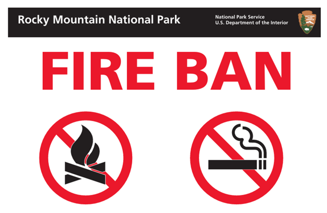 Sign with red text that reads "Fire Ban" with a symbol for no fires and no smoking.