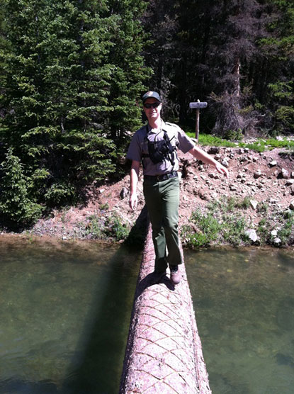 Backcountry Ranger on footbridge in Rocky Mountain National Park.