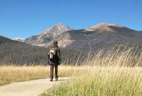 Fall intern of Rocky Mountain National Park walking in the Kawuneeche Valley.