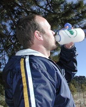 a photo of a person drinking water
