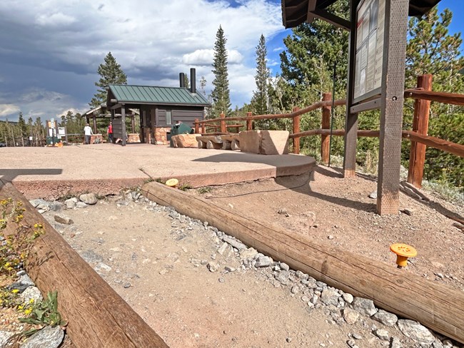 Erosion damage around the trailhead kiosk and where the plaza area transitions to the Glacier Gorge Trail