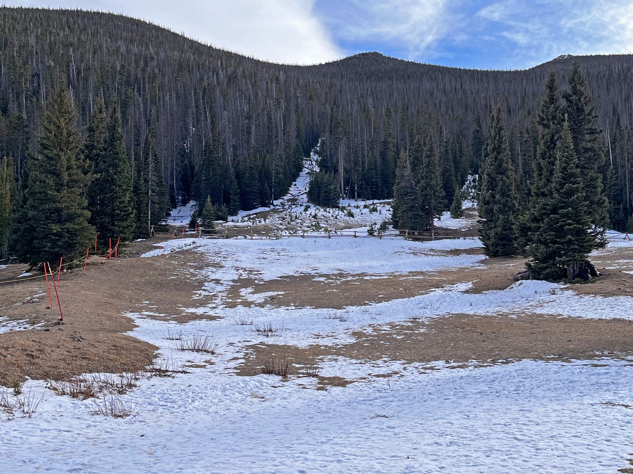 Hidden Valley Sledding Hill, with bare ground and patches of snow