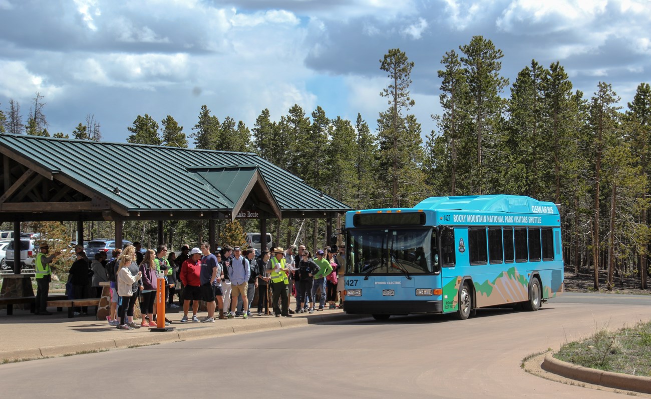RMNP shuttle bus and visitors at Park & Ride