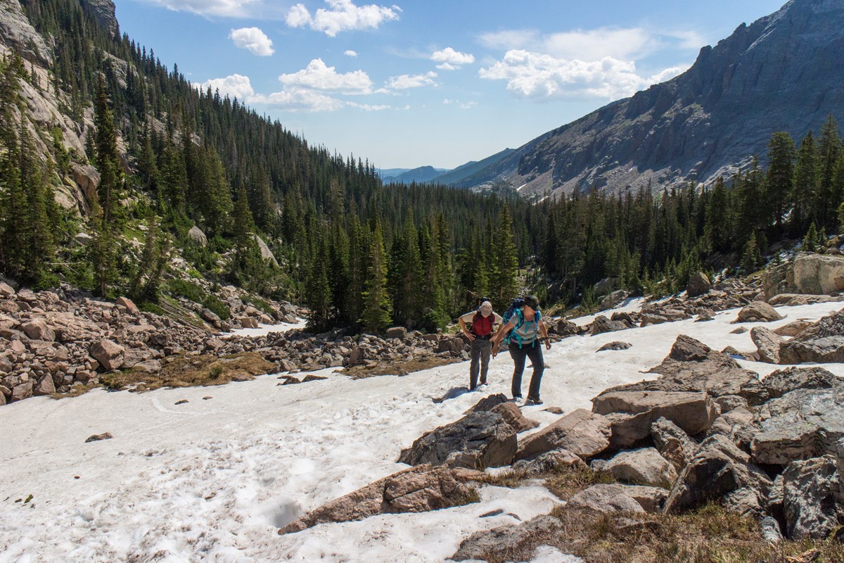 Hiking in spring in RMNP often includes crossing snow.