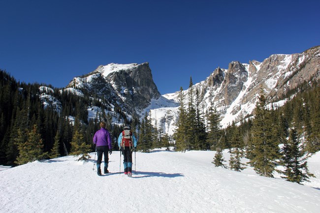 winter hikers with traction devices credit NPS photo