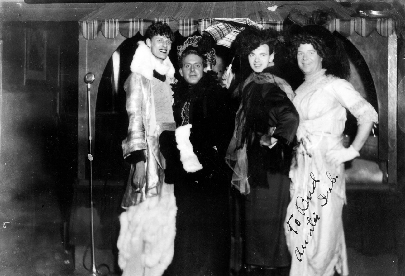 Historic image of four drag performers.