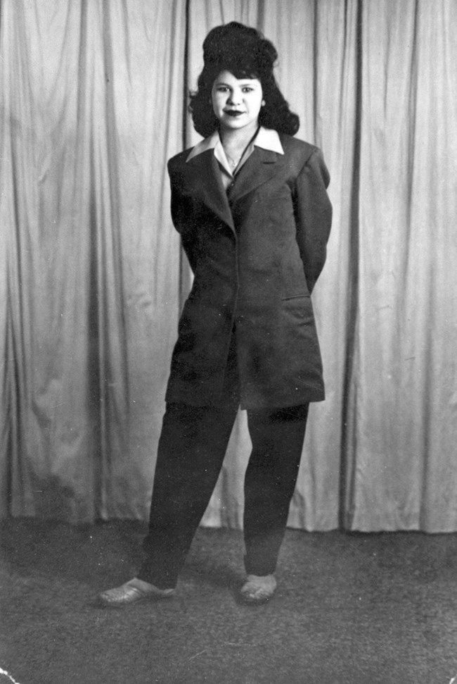 Latina woman in a suit. Black and white historic photo.