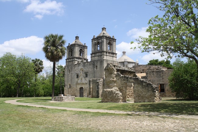 Three-story mission-style church.
