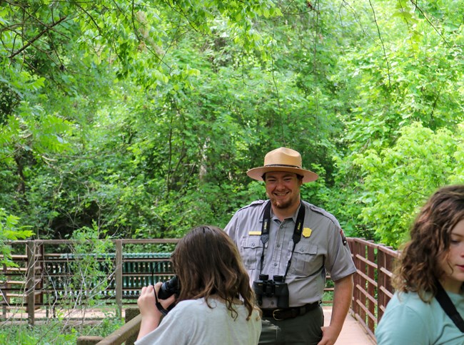 park ranger smiling at a family
