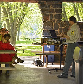 A Department of Natural Resources biologist talks at a state park.