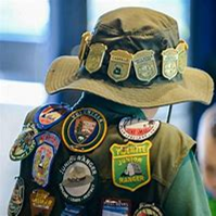 Junior Ranger badges on a child's hat and vest