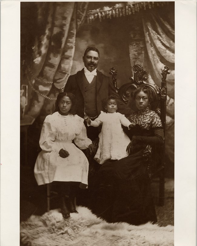 historical photograph of a wealthy black family posing for a portrait