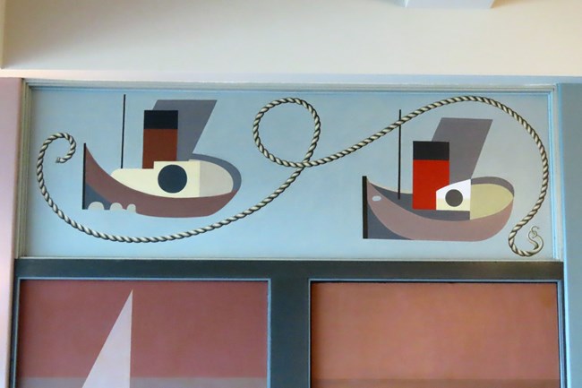 detail of abstract tugboat murals on a wall