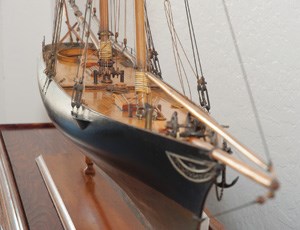 A closeup of a scale model of the yacht AMERICA.