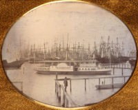 This quarter plate daguerreotype is of the riverboat Erastus Corning with the owner Charles Minturn standing in the foreground, San Francisco, Calif., circa October 1850. The photograph is attributed to the daguerreotypist Frederick Combs. (P81-010.1cps)