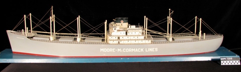 Model of the Mormacyork freighter with a grey hull, mounted on a blue board