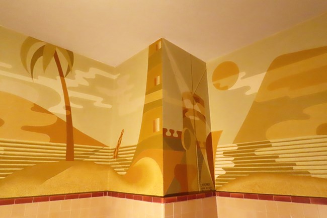 detail of seascape-themes murals on a corner of a wall