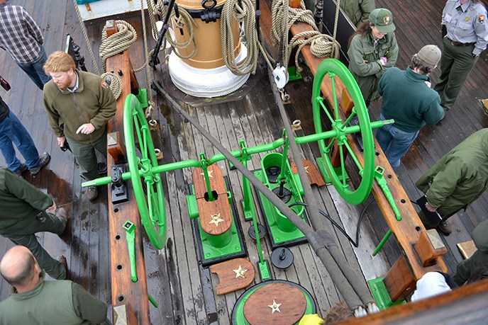 A photograph looking down on the bilge pump on the main deck of a sailing ship.
