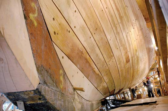 Close-up view of the ship's new stem post and new hull planking.