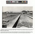 WPA black and white photograph of beach, promenade, and bleachers under construction