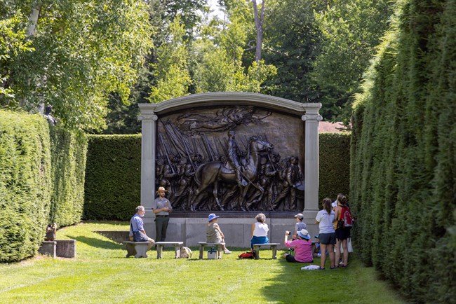 ranger and group in front of Civil War monument
