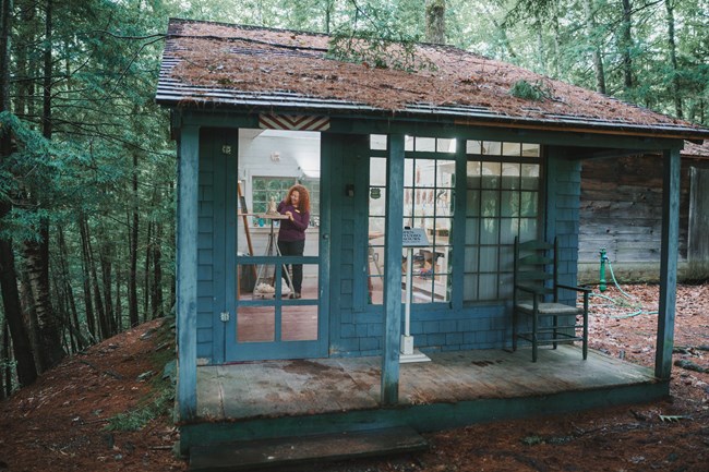 small sculpture studio with sculptor working inside