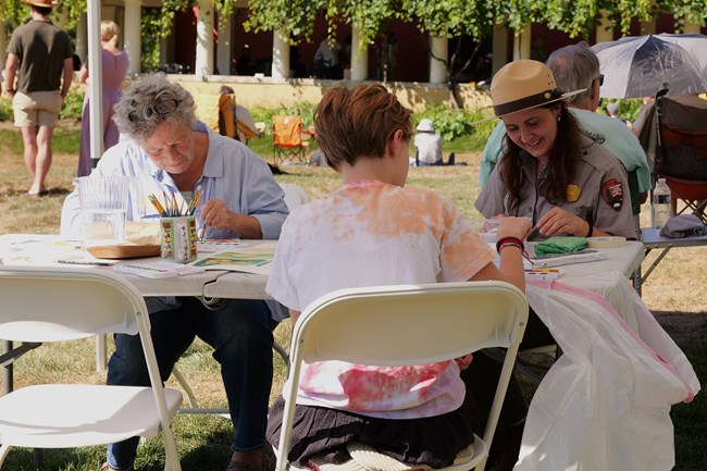 ranger leading art activity for family