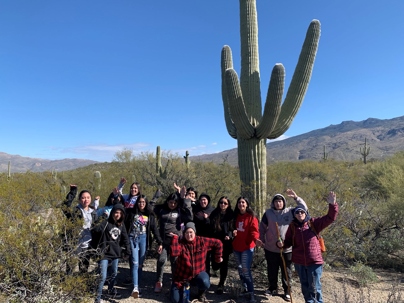 Students posing like a saguaro.