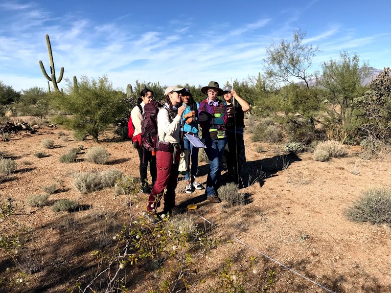 Park staff explaining to students how to use a clinometer