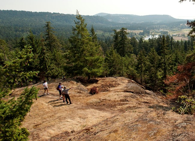 Hikers on a rocky hill