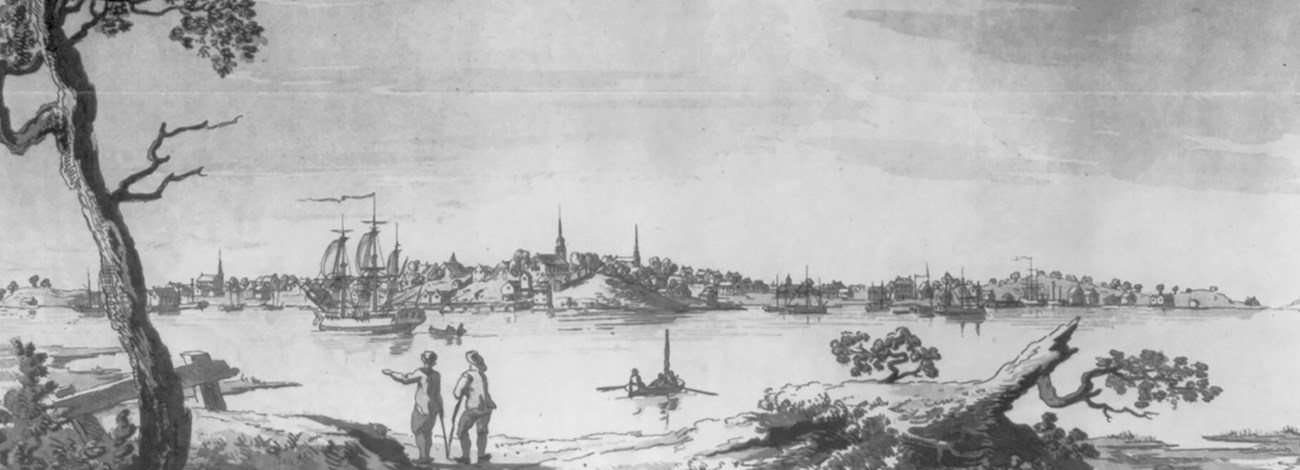 Black and white engraving showing a body of water with multiple sailing ships. A small city over looks the water from a hill.