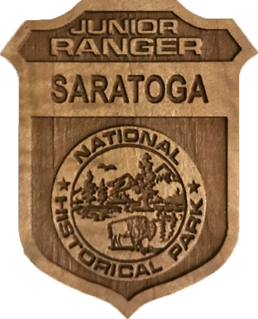 wooden junior ranger badge with saratoga in the top banner