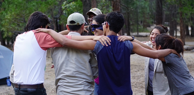 A youth volunteer group plays a team building game