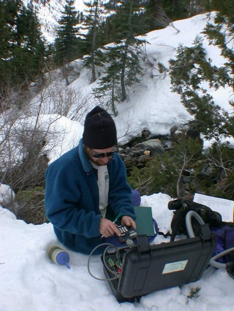 Cave specialist collects data on karst system in park.