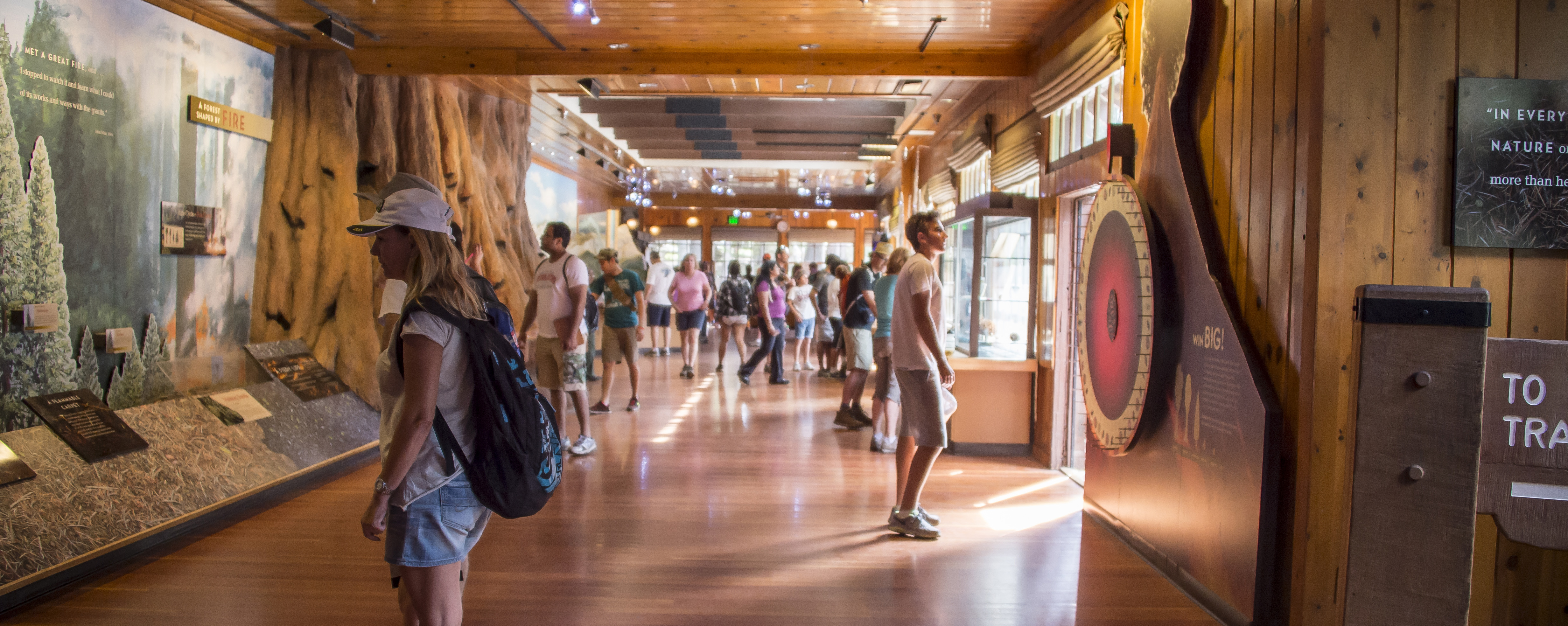 visitors view exhibits in a rustic museum