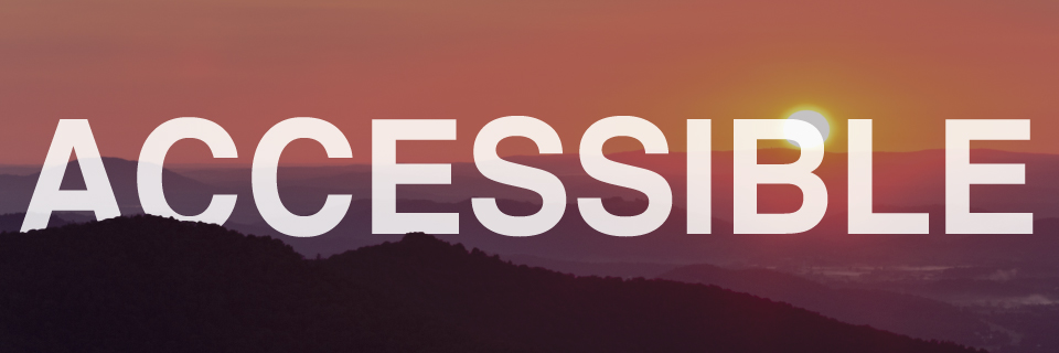 Mountain layers in the foreground with a bright orange sun rising in the background. White text is overlayed on the image. It reads: Accessible.