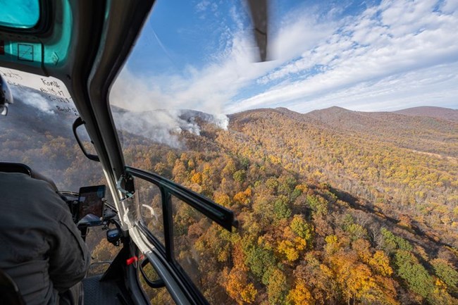 View of smoke along the ridge from a helicopter