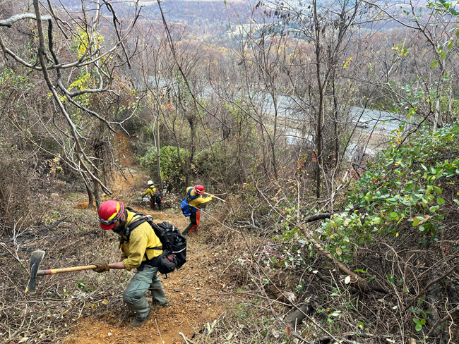Firefighters on steep terrain