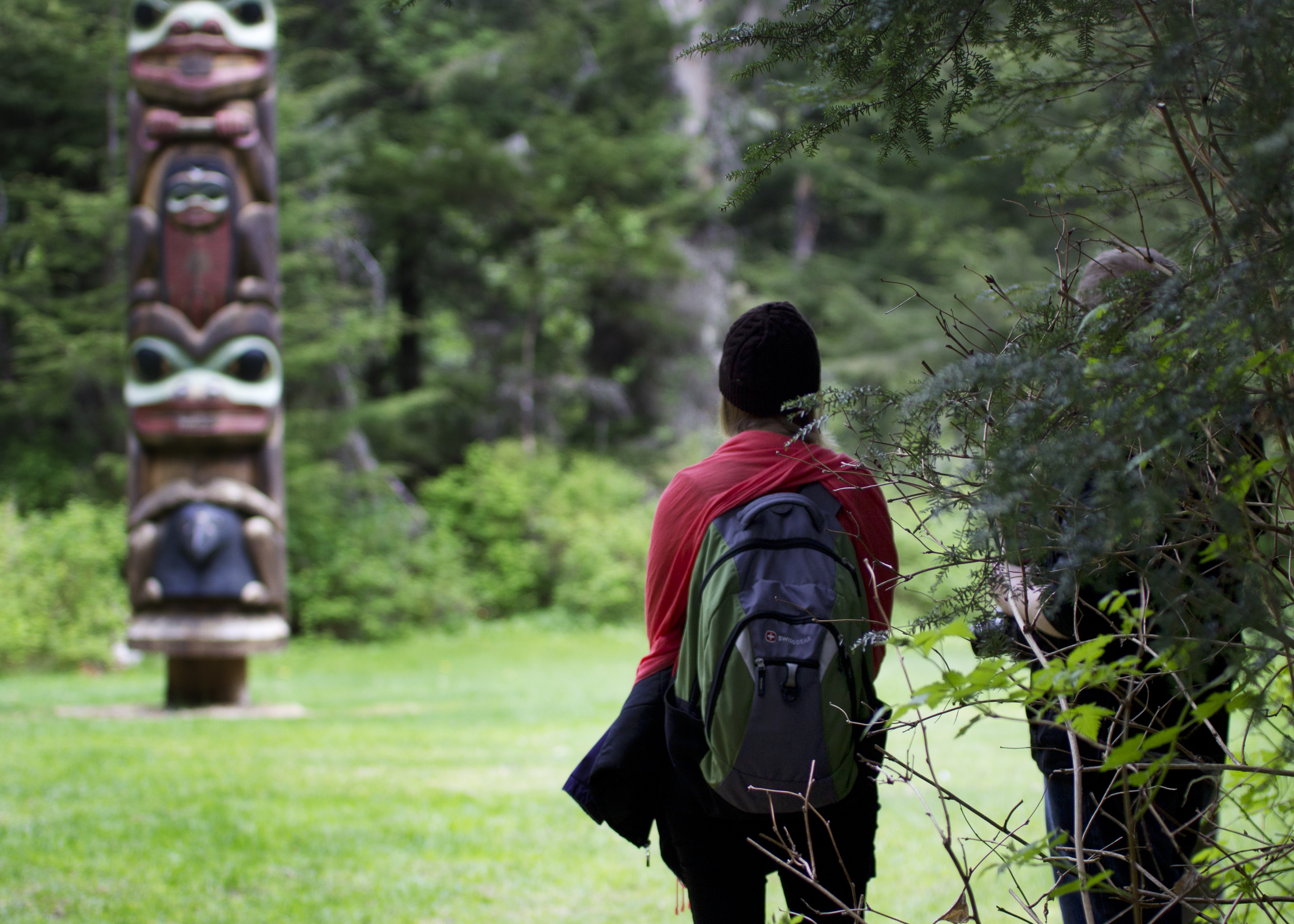 Women looking at Totem Pole