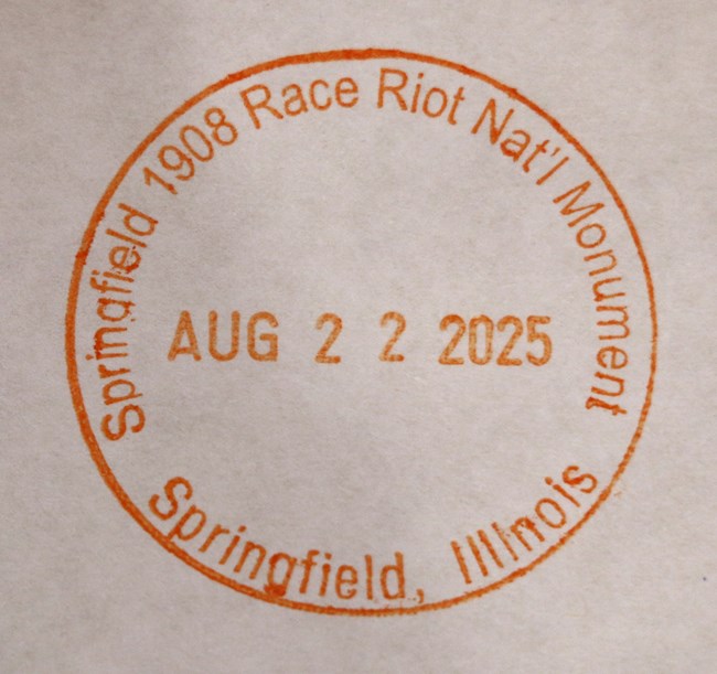 Springfield 1908 Race Riot passport stamp, stamped in orange ink.
