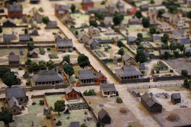 Several historic houses on a diorama showing town in 1832.