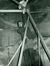 A worker inside the Statue's interior making improvements during the 1980s restoration.