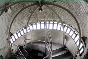 Photo from the interior of the Statue of Liberty's head looking down the spiral staircase.