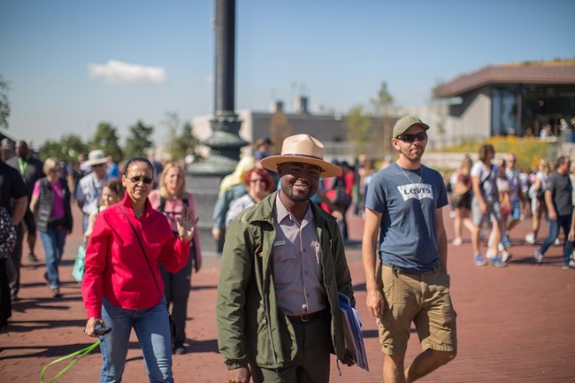 A park ranger guides a tour on Liberty Island