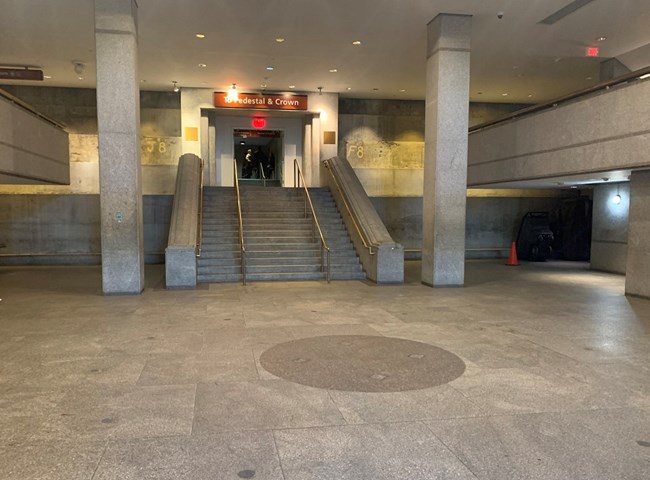 The lobby of the monument with the stairs leading up in the center