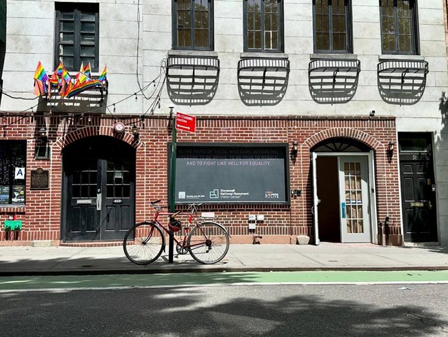 A storefront with a darkened window.